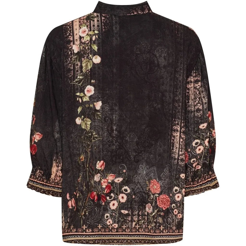 Mørk skjorte med blomstermønster, elastiske mansjetter og knappestolpe. Visning bakfra.