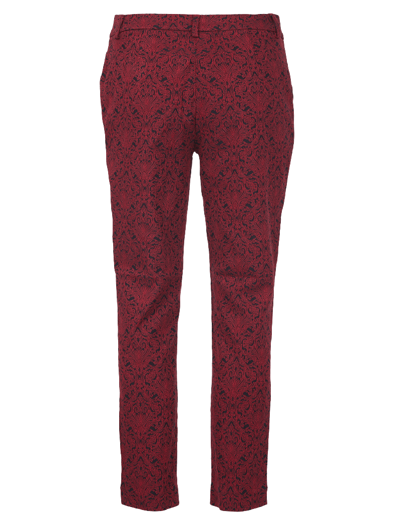 Bukse med detaljert mønster i mørkere farge på lysere bakgrunn, med beltehemper.