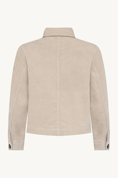 Baksiden av beige skjorte med klassisk krage og knappede mansjetter. Stoffet ser teksturert ut.