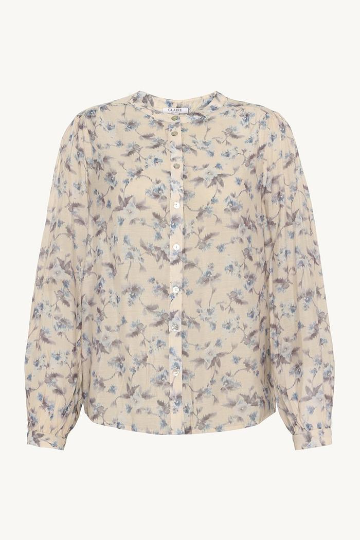 Blomstrete bluse i lyocell med knapper foran, lange ermer og rund hals.