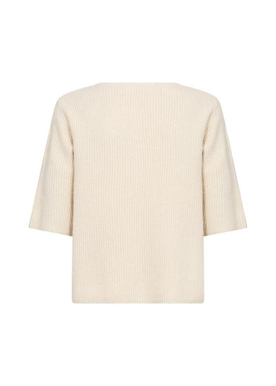 Tilbake av cardigan, lys farge, strikket tekstur, trekvartlange ermer, ingen synlige knapper.