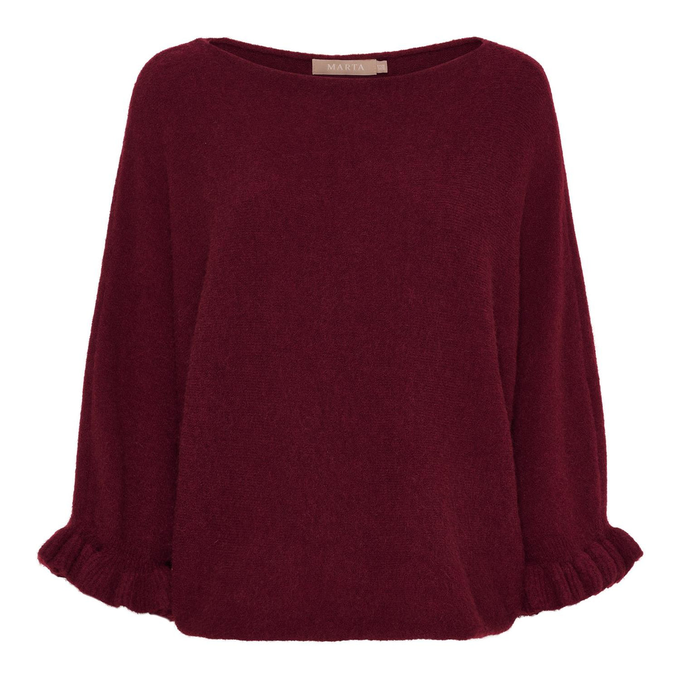 Dyp rød strikket genser med rund hals, lange ermer med rysjer, og løs passform.