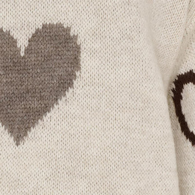 Genser med hjerteformede mønstre i brunt og grått, løs passform, lange ermer, rund hals.