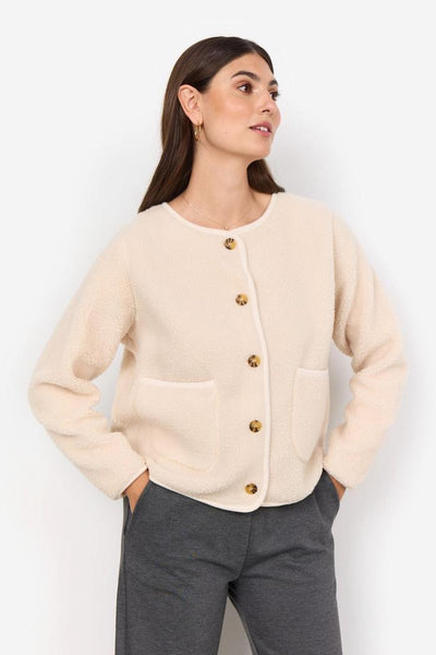 Lys cardigan i fleece-stil med knapper og to lommer. Avslappet passform.